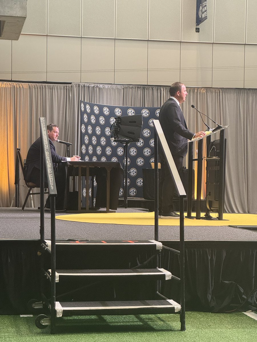 herbvincent's tweet image. The final day of @SEC Football Media Days gets kicked off with @MizzouFootball coach @CoachDrinkwitz as longtime press conference moderator @KTHogs looks on.