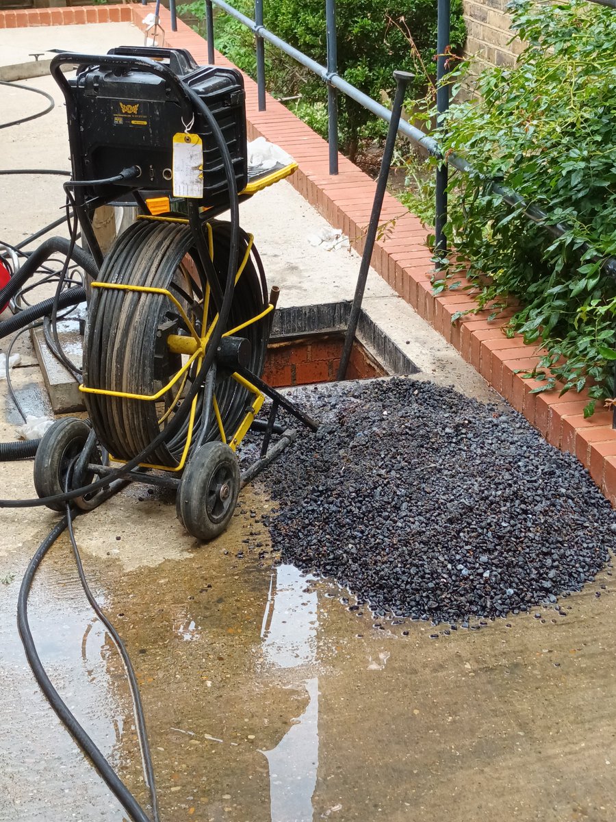There is no break. He thinks the shingle has been down there since 2014, when the back was converted, but that doesn't make sense. It ought to have blocked way before now. He says it's all along the pipe. It's the stuff they bed around the pipes, but it shouldn't be inside it.