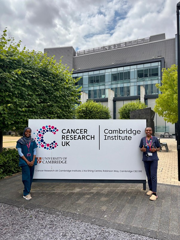 ICOMakchs's tweet photo. Masaba Halima and Orishaba Patience, 4th year medical students undertaking an Oncology rotation at Cambridge University.  The rotation is part of Cambridge commitment to building capacity in Oncology https://t.co/VCPkt7th0D