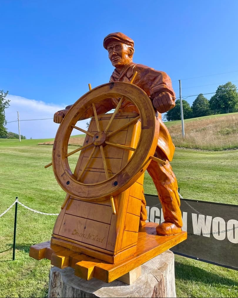 SailBluenoseII's tweet image. What an honour to witness the unveiling of this beautiful Angus Walters wood sculpture by DaVinci In Wood Chainsaw Carvings at Bluenose Golf Course!