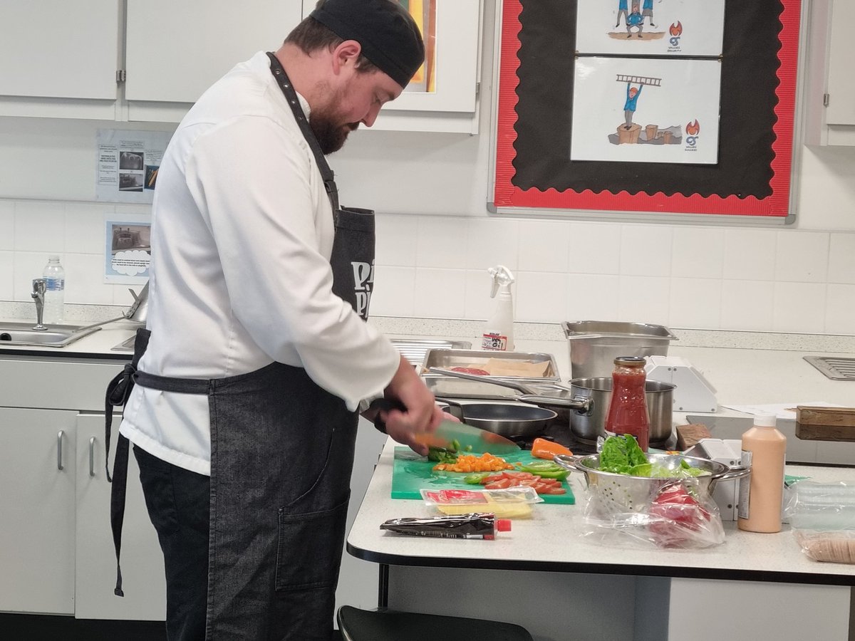 Aramark are with our Sixth Formers today, teaching them 'survival cooking'