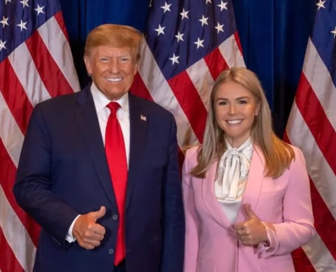 Why does Karoline always look like the doting granddaughter looking  adoringly up to gramps?