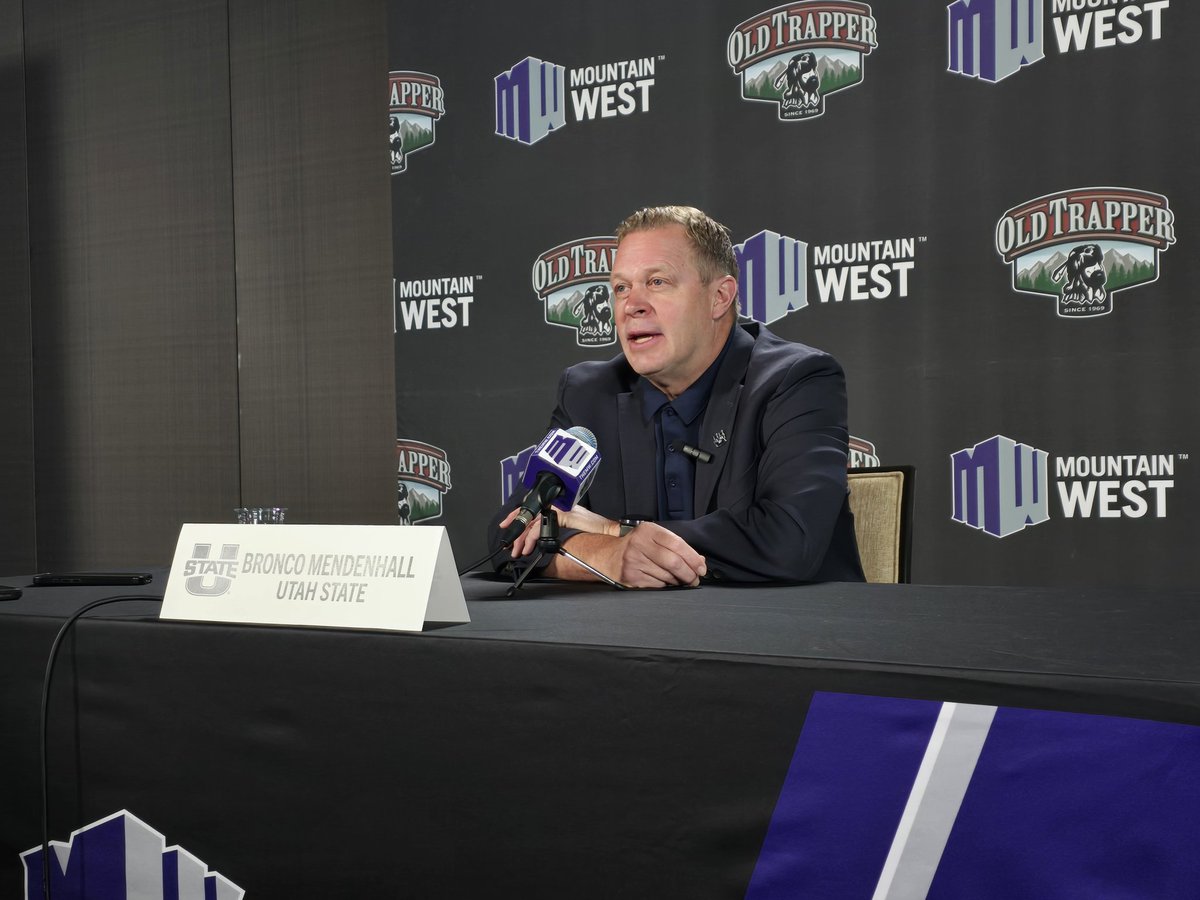Former UNM and current Utah State head football coach Bronco Mendenhall starts off at the podium at the second day of MWC Football Media Days.