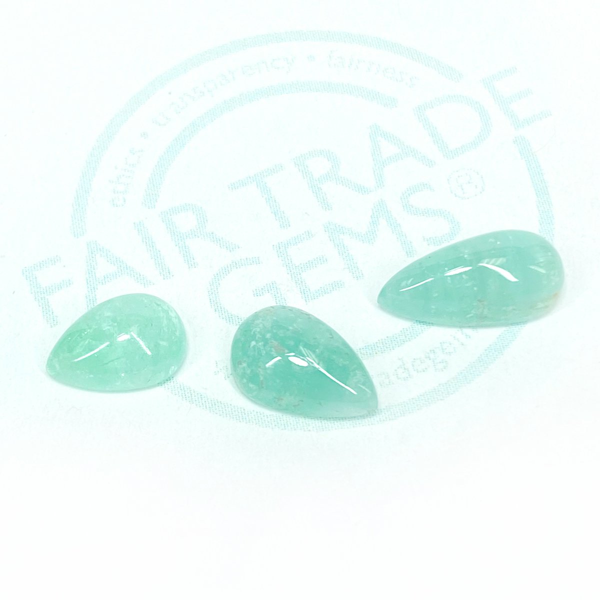 Neon Green Beryl™ is one of our signature gem varieties. We cut anything from tiny rounds and baguettes to larger gems. These 2ct pear shape cabochons are somewhere in the middle. Most people would sell this as a lighter emerald, but we think it has such a magical color.