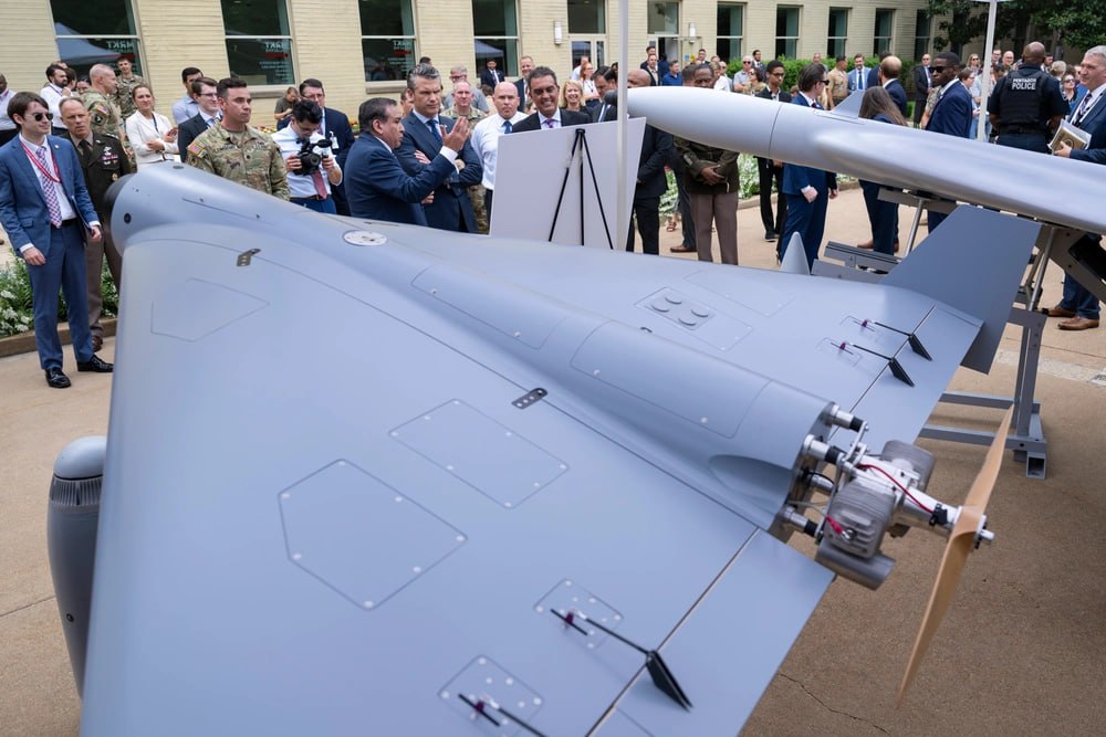 IranDefense's tweet photo. The US defense company SpektreWorks unveiled it's new Shahed-136 in the presence of US Defense Secretary Pete Hegseth

The new UAV is dubbed LUCAS (Low-Cost Uncrewed Combat Attack System). Note the assortment of guidance packages, from IR/EO to GNSS/INS. Just like on Shahed-136 https://t.co/CqADgA2F8h