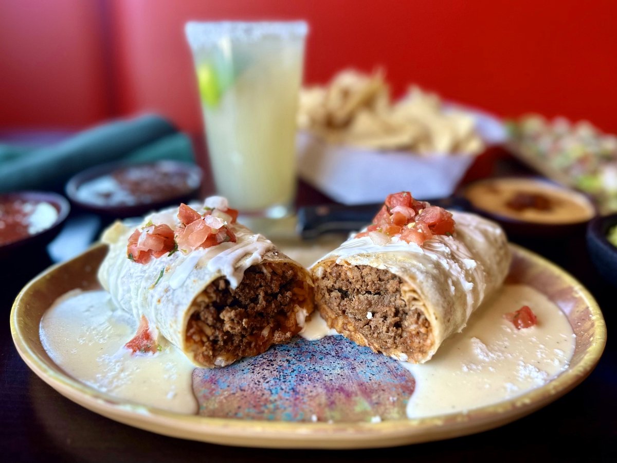 🌯 Say hola to your new obsession: the Cheesy Ensenada Beef Burrito at Hussong’s Cantina! 🧀🔥

Stuffed with bold flavors, smothered in melty cheese, and wrapped up like a warm hug. Warning: one bite may cause spontaneous happy dances! 💃🌶️ #HussongsCantina