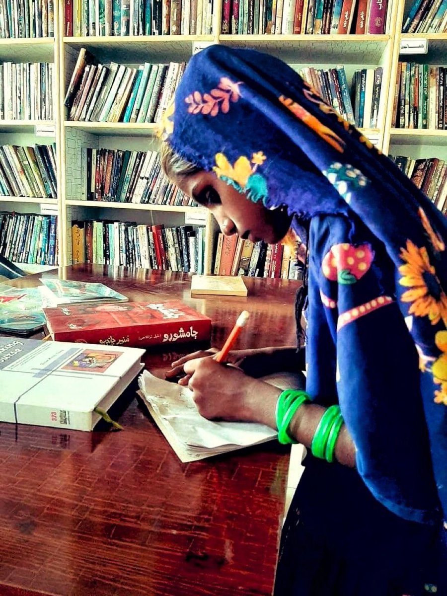 A girl studying in Mama Juman Darbdar , We #SindhReads &amp; friends contributed for library in the name of Mama Juman Darbdar library two years ago, later Wife of Justice Salah Din Panhwar donated 12 computers &amp; I arranged 3 laptops