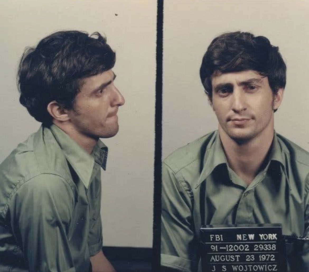 Mugshot of John Wojtowicz, who unsuccessfully tried to rob a bank in 1972 to pay for his wife Eden's gender reassignment surgery. Apparently, Wojtowicz had based his plans on the movie, "The Godfather" (1972), which he had watched earlier that day. 

2,000 onlookers, FBI,