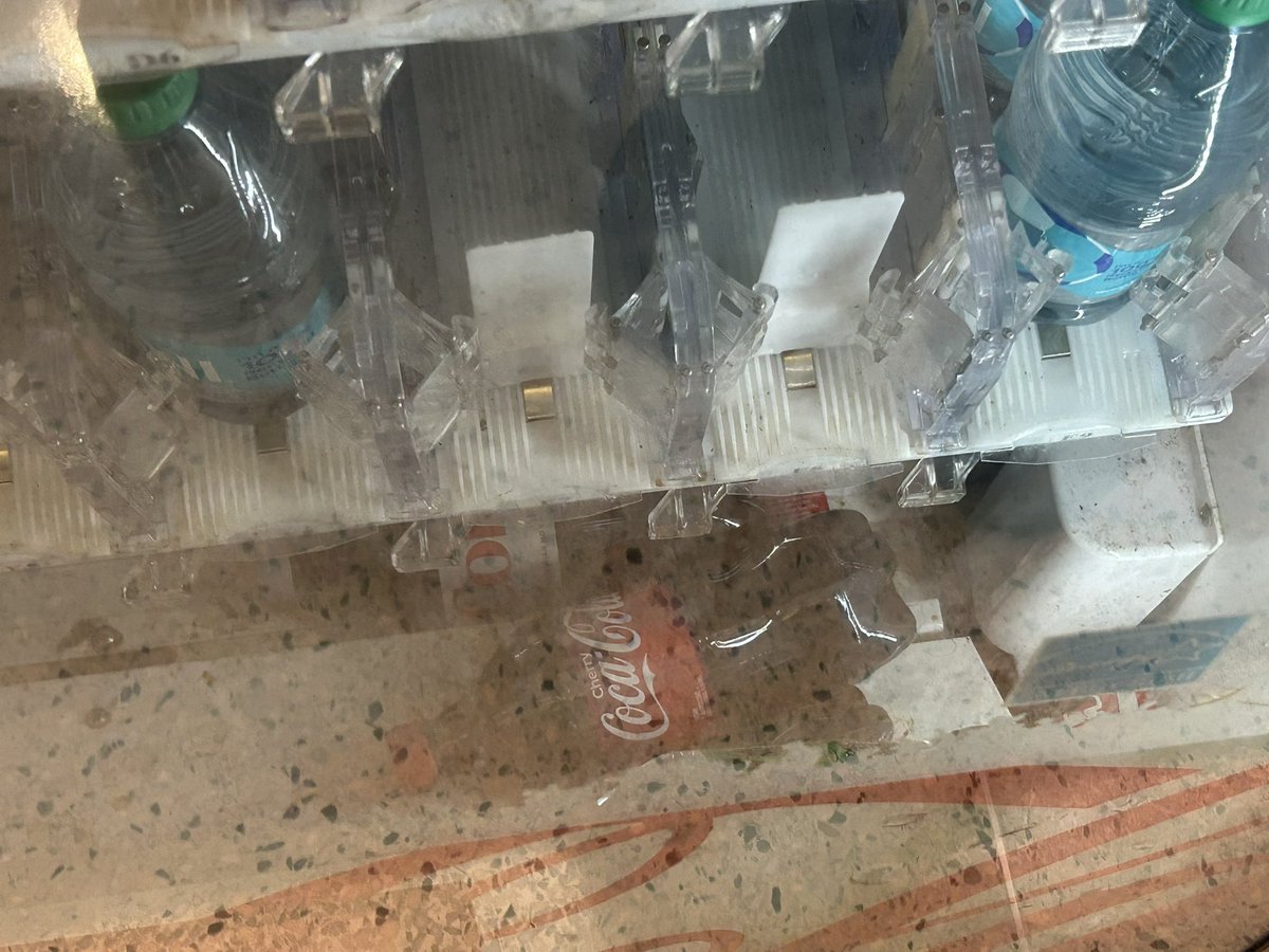 Bellmanequation's tweet image. At the airport you pay $3.80 to watch Cokes be pushed over the ledge and fall to the floor of the machine, never to be retrieved