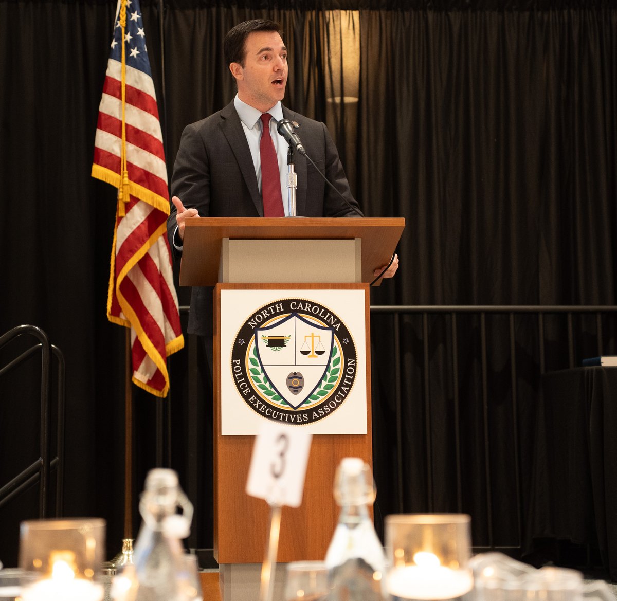 NCAGO's tweet image. This week, Attorney General @JeffJacksonNC spoke at the North Carolina Police Executives Association's annual summer conference in Wilmington, discussing NCDOJ's work to support law enforcement and protect North Carolinians from scams and fraud.