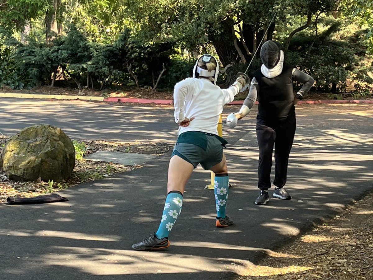 Instructor Vlok takes Sabre lesson from Maestra Coblentz outside at #FMCP2025
