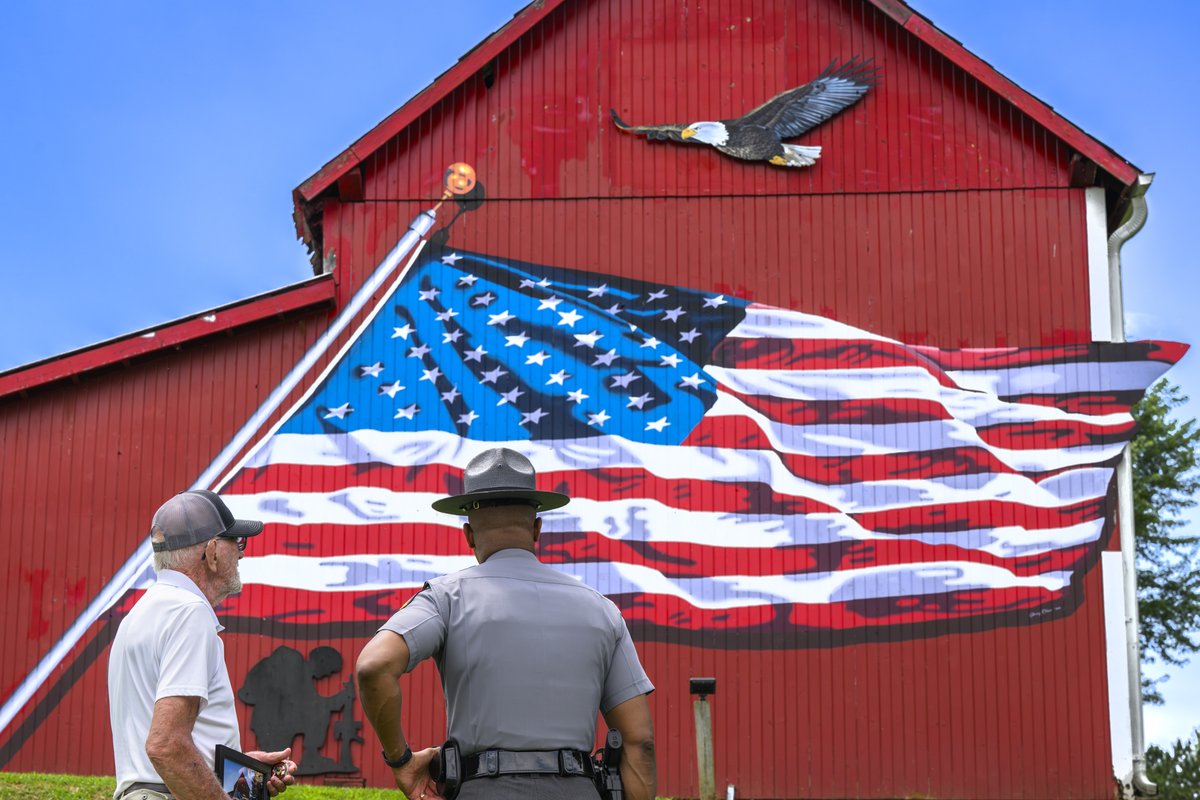 OSHP's tweet image. Yesterday, Colonel Charles A. Jones, Patrol Superintendent, met with Larry Kornmiller, the local barn owner who opened his doors for our Best Looking Cruiser Contest entry. His generosity set the perfect scene.