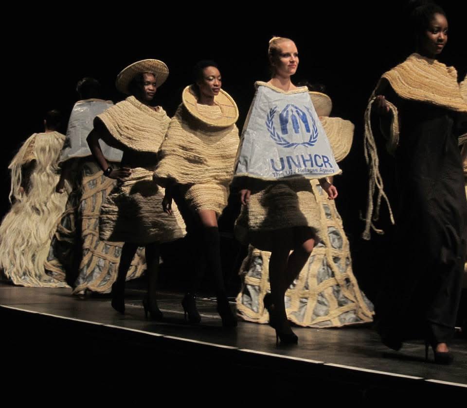 InkuruLibrary's tweet photo. “𝐈𝐟 𝐭𝐡𝐞 𝐒𝐞𝐚 𝐂𝐨𝐮𝐥𝐝 𝐓𝐚𝐥𝐤” is a collection of 40 outfits designed by Rwandan Genocide survivor, Author, journalist, and #Artivist Dady de Maximo Mwicira-Mitali, created to pay tribute to the missing and dead refugees in the oceans, seas, desert, containers but also symbolizing the life and suffering of migrants and refugees.
Supported by the Dutch Royal Family through the Prince Claus Fund, Documenta15, Danish Art Funds, this collection was showcased at the Prestigious Contemporary Art Festival 𝐃𝐨𝐜𝐮𝐦𝐞𝐧𝐭𝐚 𝐅𝐢𝐟𝐭𝐞𝐞𝐧 in July 2022 in Germany.
Dady’s art work presented at this festival remains a unique and pioneering creation using fashion as a powerful medium to represent suffering and memory. And his fashion show became a space where remembrance is evoked, reflection is inspired, and human stories are shared with the world.
📸: Dady de Maximo (@DadydeMaximo)
#Art4Memory #Memorialization #Storytelling #Historiography #Art #History #Refugees #Remembrance #fashionhistory