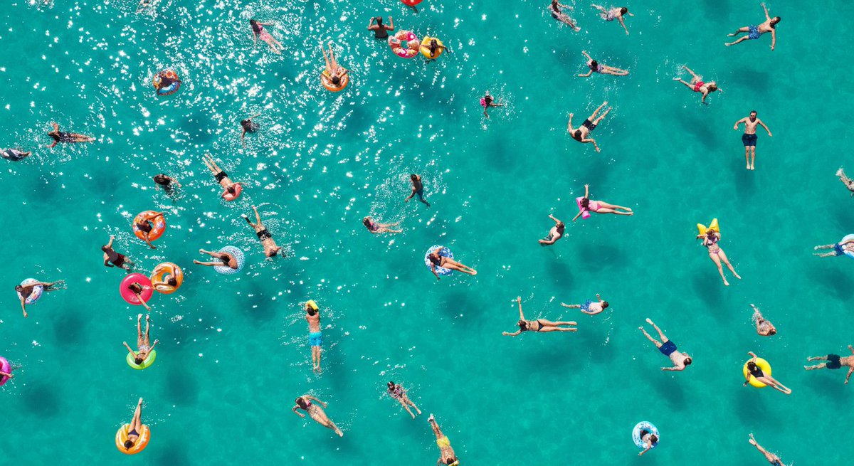 Team_Greenfield's tweet image. Generated with Imagen 4  

Prompt: Viewed from directly above, this image is a vibrant and dynamic scene of dozens of people enjoying a swim in brilliantly clear, turquoise water. The composition is a chaotic yet joyful scattering of human figures across the entire frame. The…