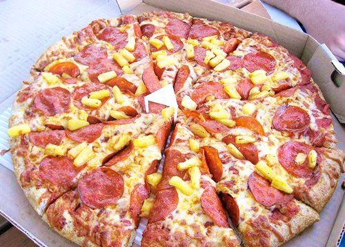 FoodPleaser's tweet image. Describe pineapple pizza in one word.