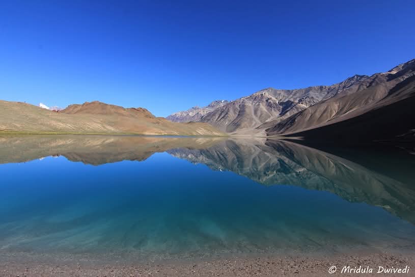 One of the absolutely gorgeous places that I have visited. This is Chandratal in Spiti, Himachal Pradesh. It doesn't need a filter but you need a sunny day. When there are clouds, the view is not this brilliant.