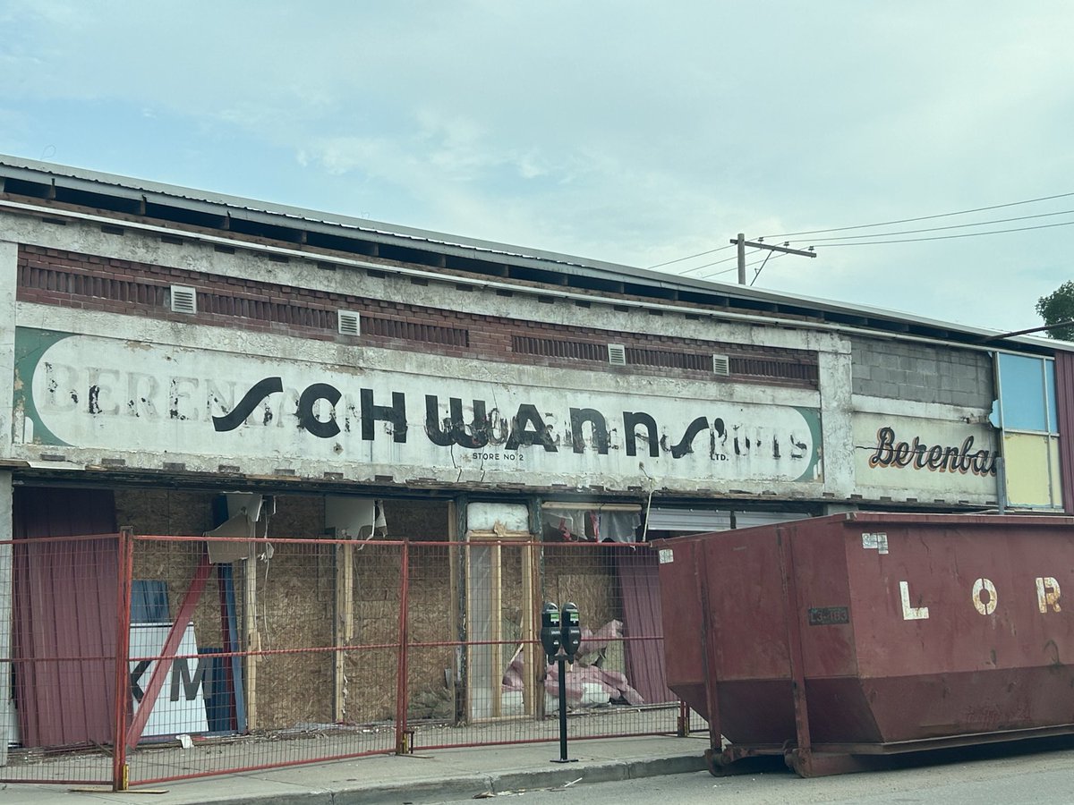 WayneMantykaCTV's tweet image. Stripping away the facade on a building near 11th Ave. and Halifax St. has revealed business signs from years gone by.