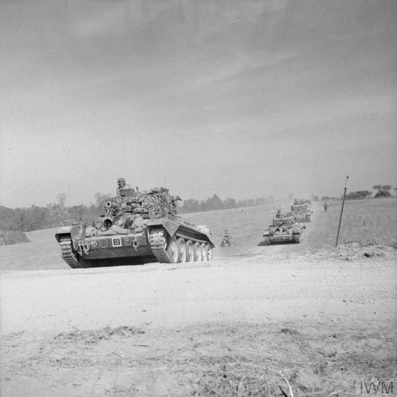 Normandy661944's tweet image. Cromwells of 2nd (Armoured Reconnaissance) Battalion, Welsh Guards, near Escoville during Op Goodwood, 18 July 1944. The artist Rex Whistler, serving with this Battalion, was killed by a mortar the same day near Giberville.
IWM B7562, Sgt Christie, AFPU
iwm.org.uk/collections/it…