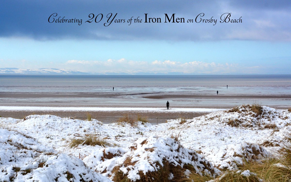RonDaviesPhoto's tweet image. The distant hills of Wales gleam under a layer of snow in the brightness of early morning winter sunlight. That same overnight snowfall has left a dusting of white across the dunes and beach at Crosby on this cold sparkling morning. @IronMenCrosby #IronMenat20