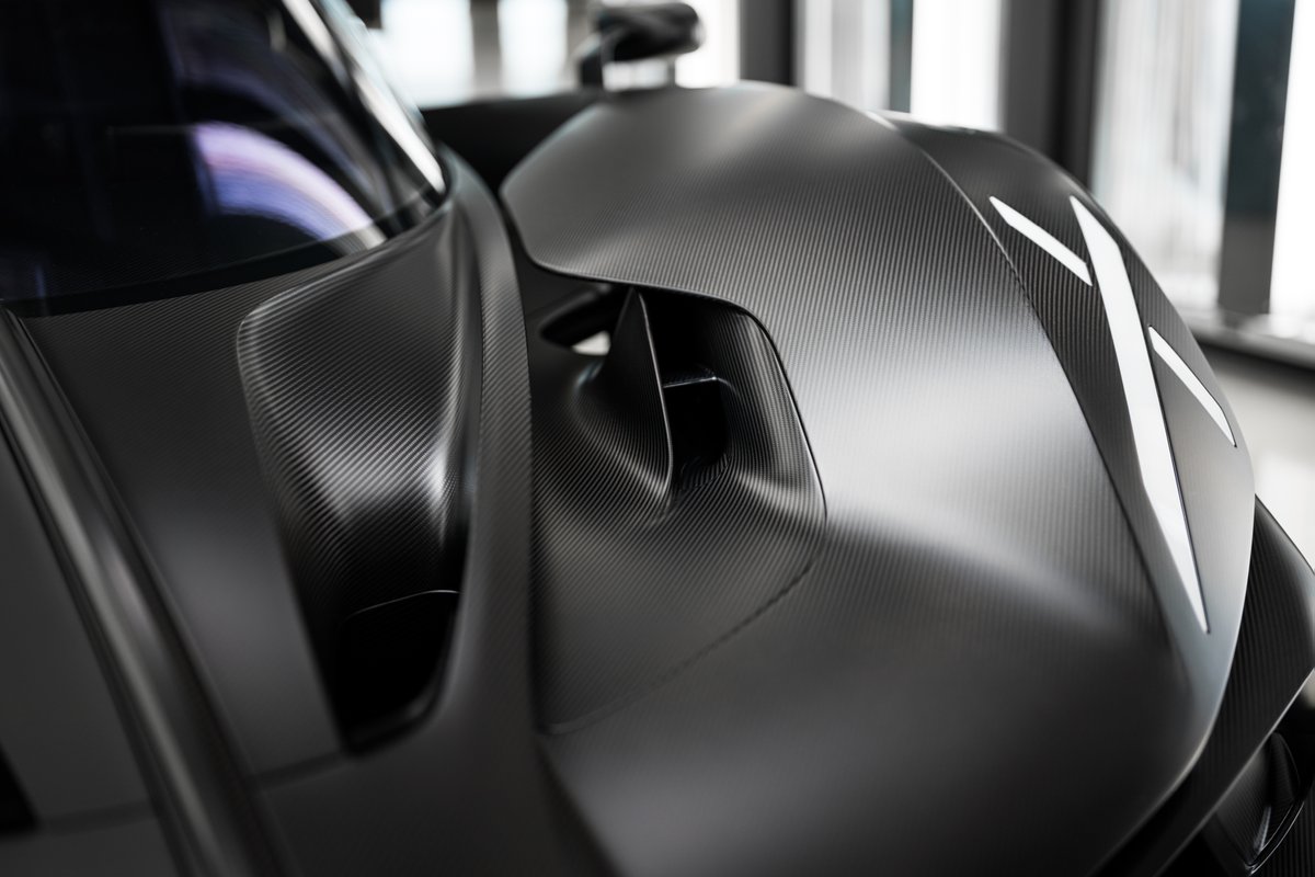 Bugatti's tweet image. In the BUGATTI light tunnel, the BOLIDE reveals what it was built for: speed, form, and the spirit of a purebred track car – finished in raw black carbon.
#BUGATTI #BOLIDE
–
bugatti.link/consumption