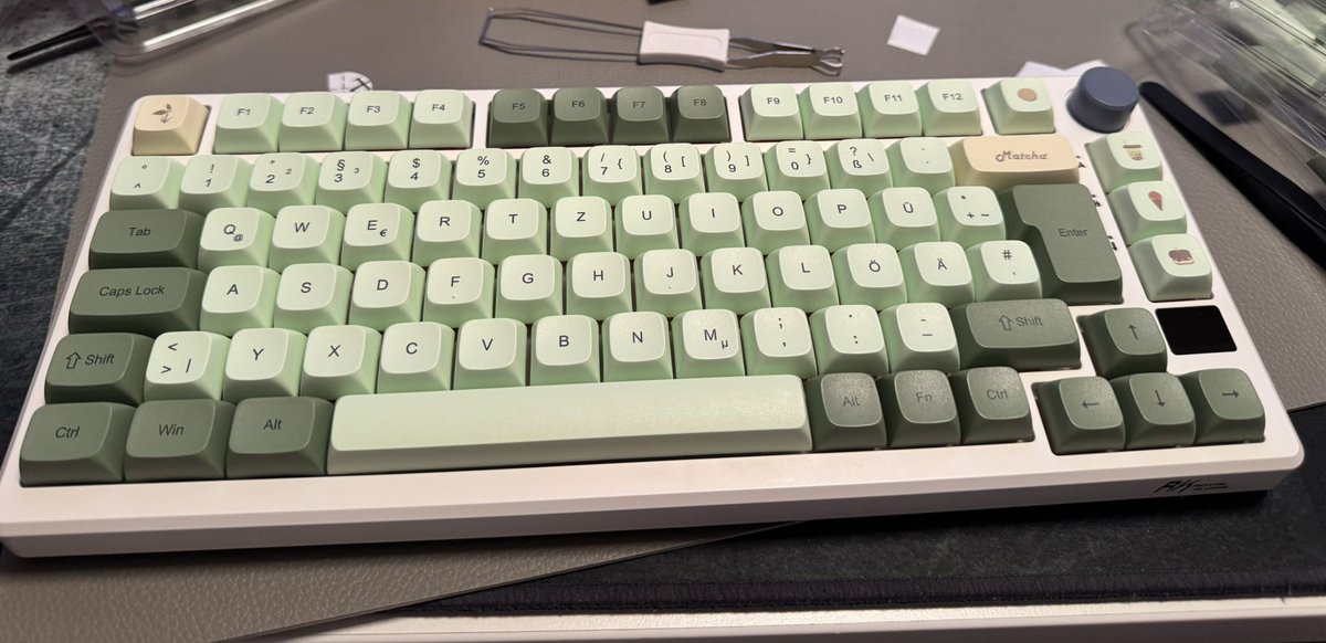 Nithoru's tweet image. 2 of my keyboards, 1st one is custom build with matcha keycaps. 2nd one is a Wooting 80HE with a ghost shell. I use the matcha one at work and the other at home. Thinking about building myself a third aesthetically pleasing one cause wooting is just for gaming and not to pleasing