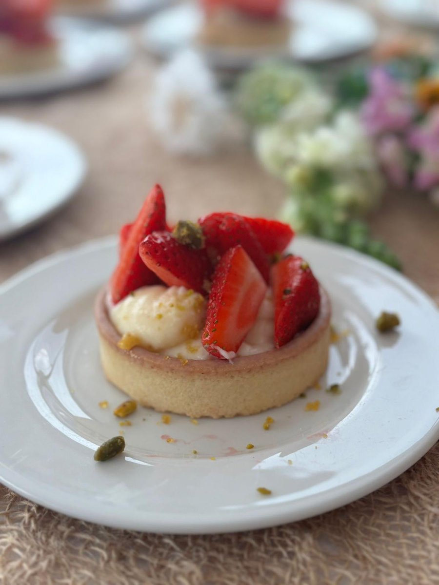 Strawberry (Shortcake) custard tart with crunchy pistachios—sweet, silky, and nutty in every bite. 

#Strawberryshortcake #ProperPudding #ClottedCreamDream⁠ #WeddingDesserts #DessertCourseGoals #2025Weddings #WelshWeddingVibes #SummerWeddings #RusticRomance