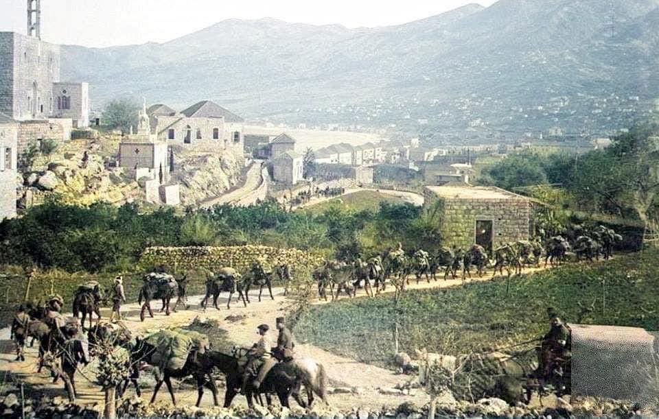 LebBlitz's tweet image. The Ottoman army withdrawing from Lebanon in 1918 through Jounieh along Zouk Road. The Saint Georges Cathedral in Sarba can be seen on the left.