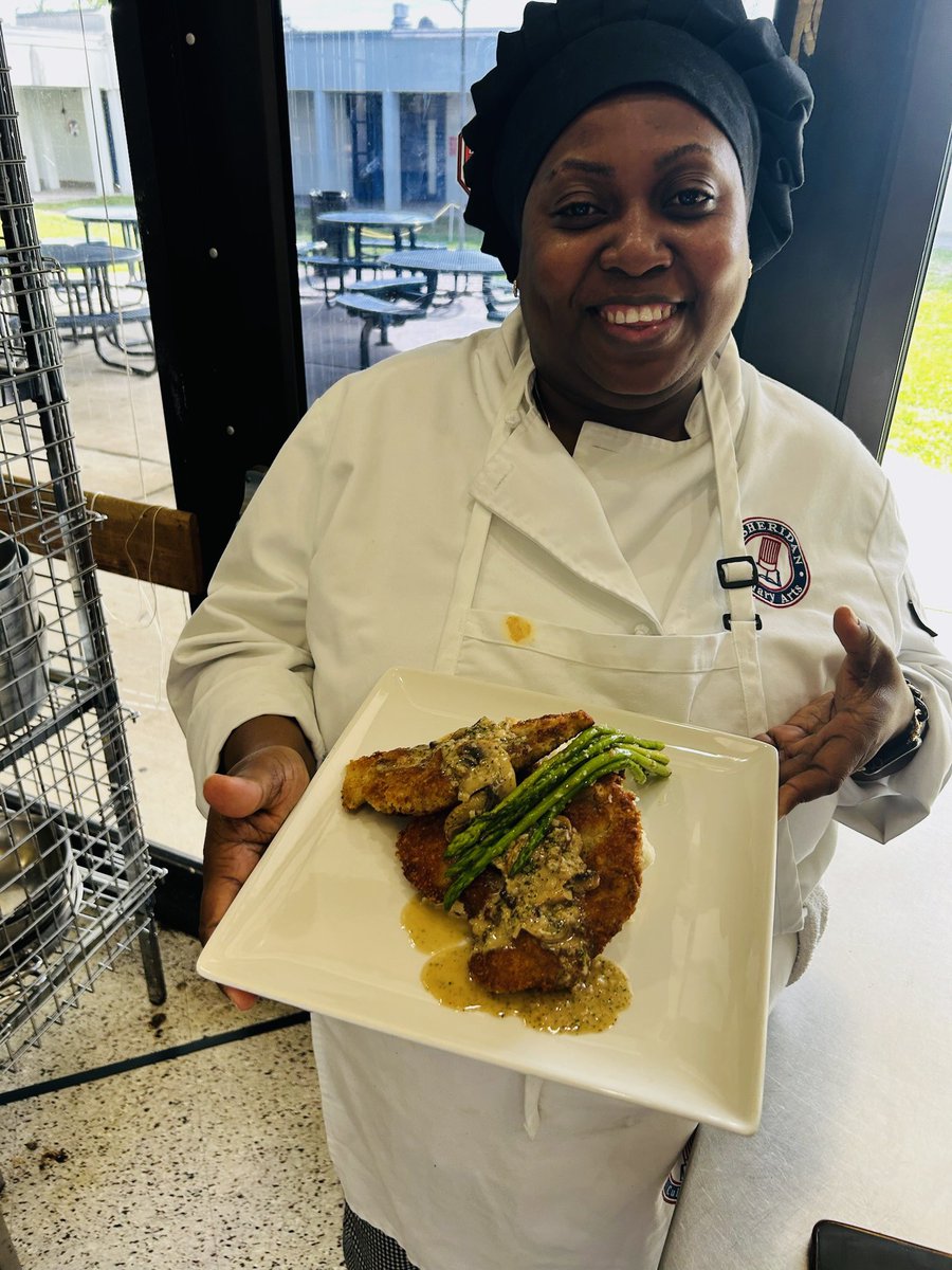 Micheline is all smiles with her Parmesan Crusted Chicken. #SheridanTech #ProfessionalCulinaryArtsandHospitalityprogram