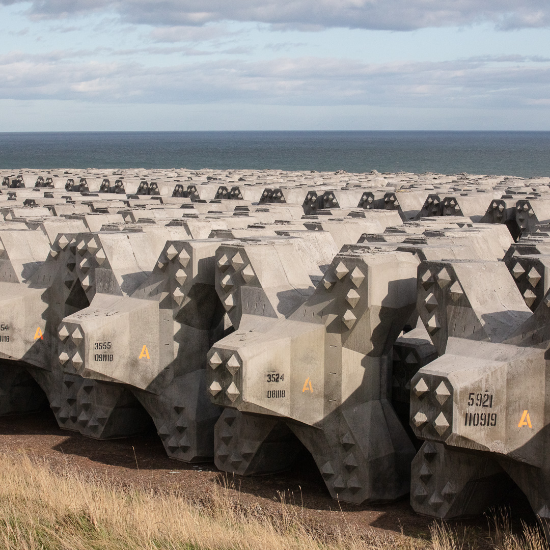 QuintinLake's tweet image. As I head south along the cliffs away from Aberdeen, I walk past what appears to be a dormant robot army looming above me at twice my height. Serried ranks of menacingly anthropomorphic angular concrete blocks face the sea as if they’ve just emerged from the ocean. Not…