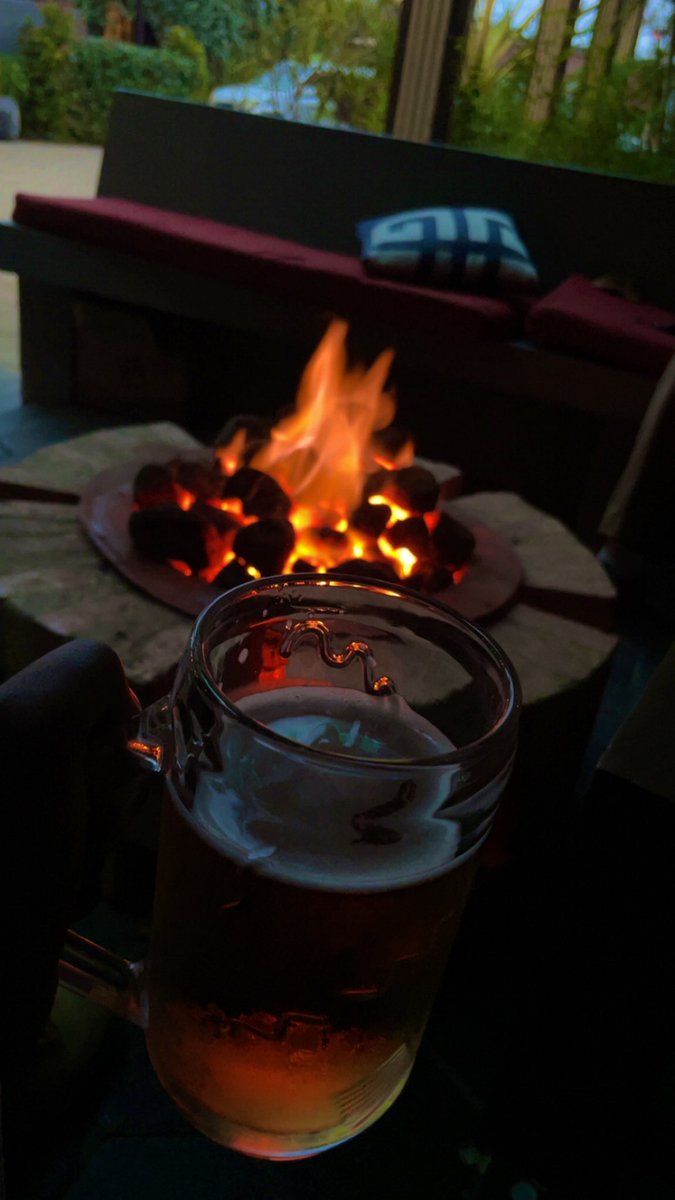 Proof that good times can be poured.🍺

Glass in hand, fire at your feet — peace tastes like this when you spend your evenings at The Booth.🔥

#VisitRolexBooth