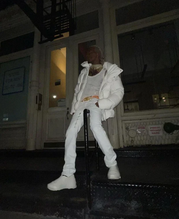 destroyfawk's tweet image. Playboi Carti wearing Givenchy Oversized Puffer Jacket, Givenchy 4G Zip-Detail Straight-Leg Jeans, and Givenchy Silver Monumental Mallow Low Sneakers
