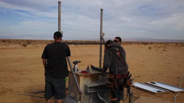 CaltechSeismo's tweet image. #FieldPhotoFriday Out in the otherworldly desert near California City. After a recent field visit to fix power issues, it's back online and transmitting data like it has been since 2002! Thanks to our field crew for braving the heat to keep the data flowing. On to the next one!