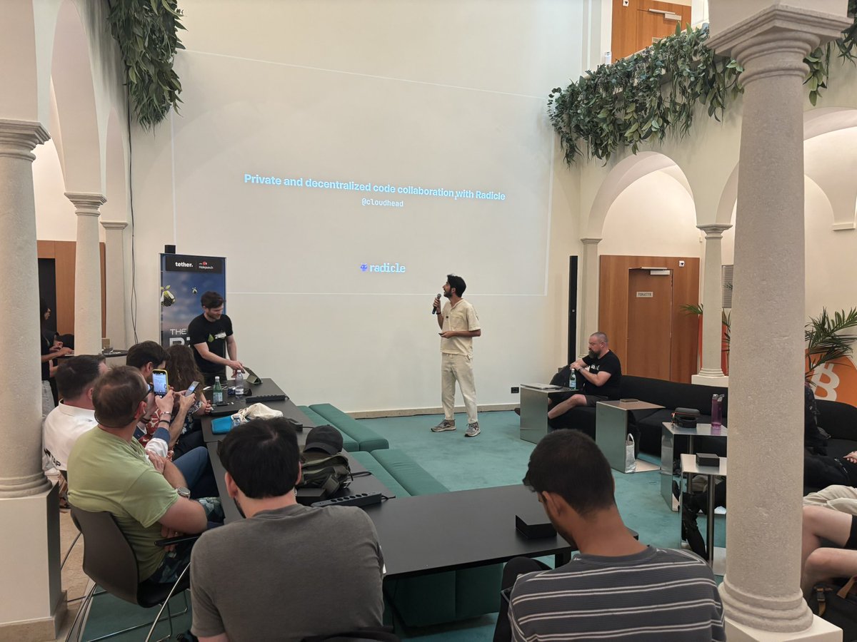 Now speaking <a href="/cloudhead/">cloudhead</a> from <a href="/radicle/">Radicle</a> , an open source, peer-to-peer code collaboration stack built on Git🍐 #P2PSummit