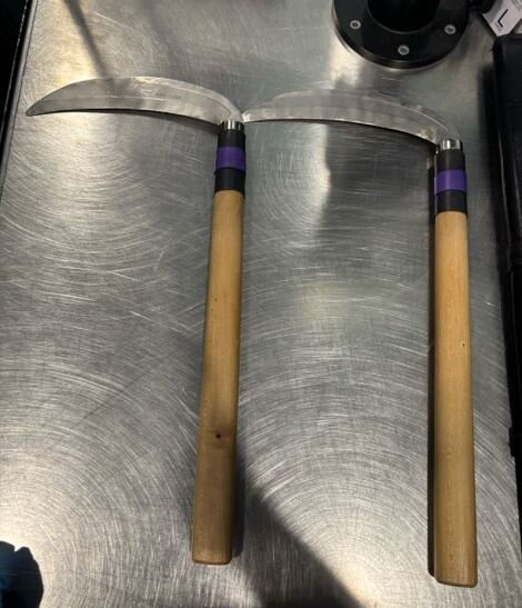 TSA's tweet image. It’s not every day that we see swords inside a carry-on bag (fortunately). Our officers at @DTWeetin discovered these last month. The passenger said they were for a martial arts competition.
Pro #TravelTip: Items like these should be safely packed in checked bags, not carry-on.