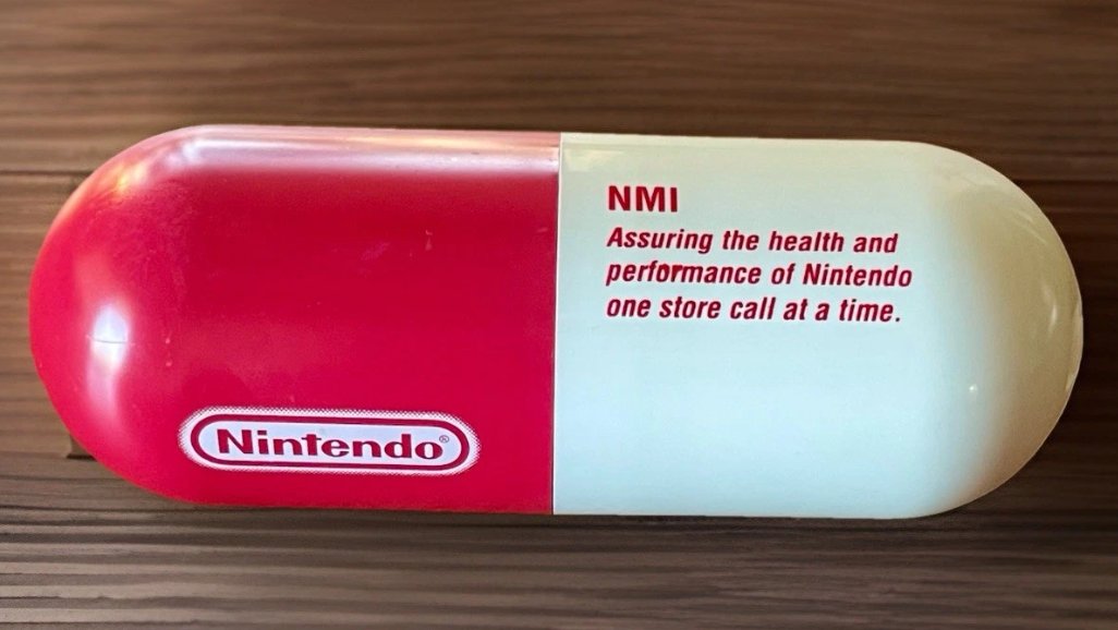 TheUltiMarioFan's tweet image. Nintendo of America store health kit, designed like one of Dr. Mario's pill capsules.
(NMI stands for NES Merchandise Inc.)