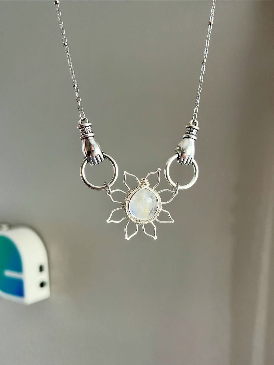 heidiswrapss's tweet image. Two hand holding sun pendants that i’ll also be adding today! Do you like the amethyst or moonstone more? ☀️💜