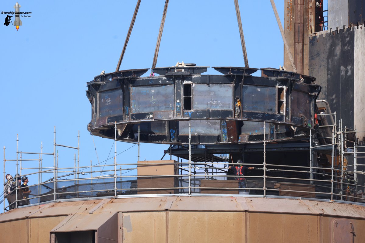 StarshipGazer's tweet image. A wider view of the Starship launch mount static fire adapter being lifted into position.
7/18/25