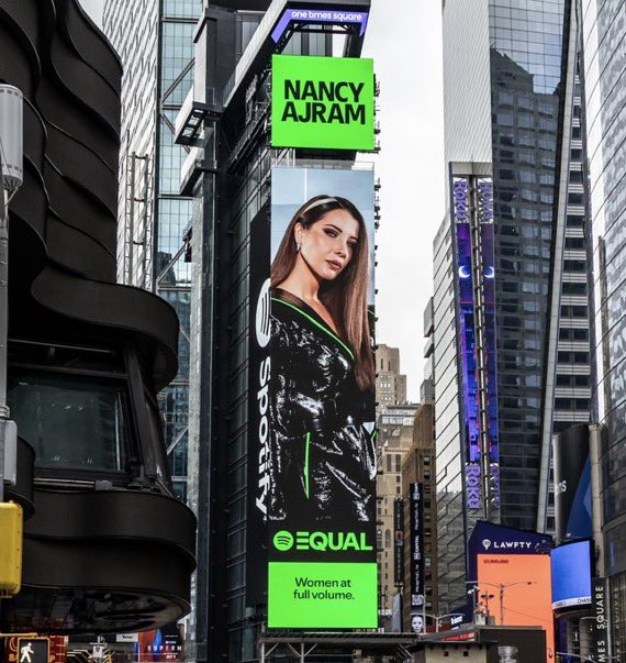 Nancy Ajram is the ambassador of ‘EQUAL Arabia’ for July on <a href="/Spotify/">Spotify</a>, ‘Ensa’ #1 on the playlist, ‘Sidi Ya Sidi’ #8.
The cover appears on Times Square, New York!