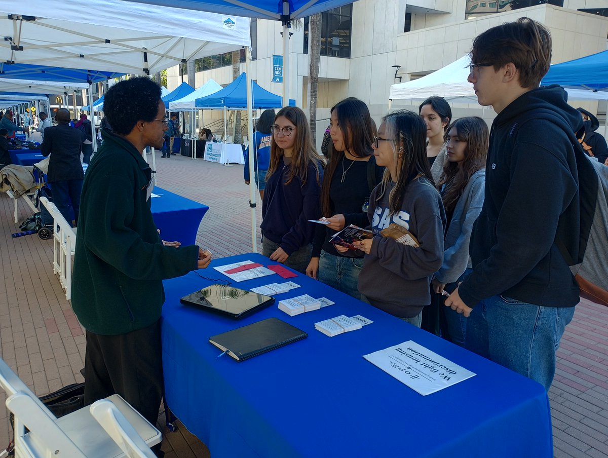 Miami Dade College (thank y'all for having us!)!  Hints that this is a #FlashbackFriday picture from another time, and not from today: 1) there aren't usually MDC fairs over the summer, and 2) people don't usually dress to stay warm when it is a 4 million-degree July in Miami! 😄