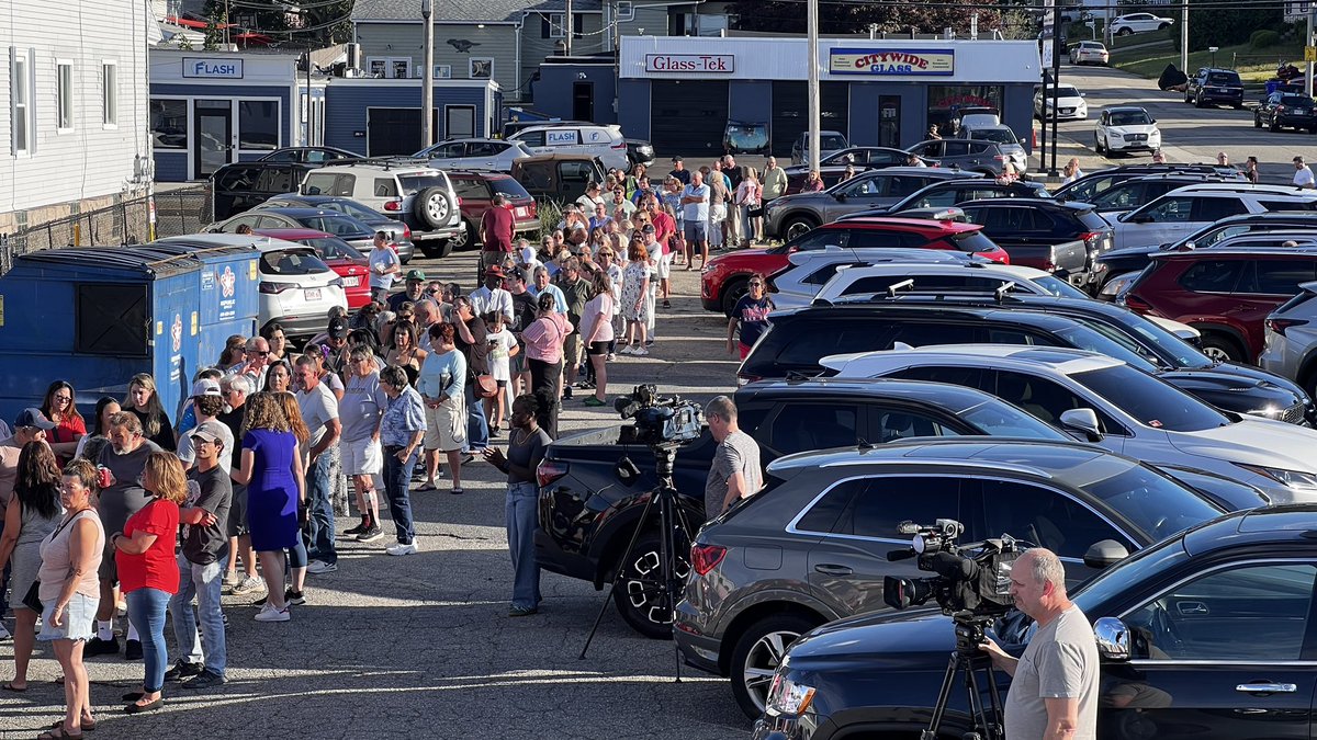 CoreyWelch's tweet image. A line of hundreds of people wrapping through the parking lot and neighborhood around the St John’s Athletic Club in Fall River for a fundraiser for the victims of the Gabriel House fire. @wpri12