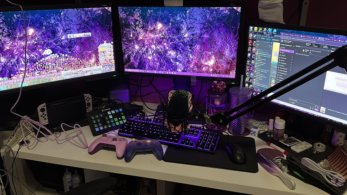 pearlynrae's tweet photo. @MLozada I have a mighty need for more purple lavender in my setup! 💜🦄 and yes I am currently using a fidget spinner to add weight to my mic arm so it doesn’t go flying to the moon 🤣 (pls ignore the mess! I practically live at my desk so all the things are on there 😭) https://t.co/irsnk3yc9H