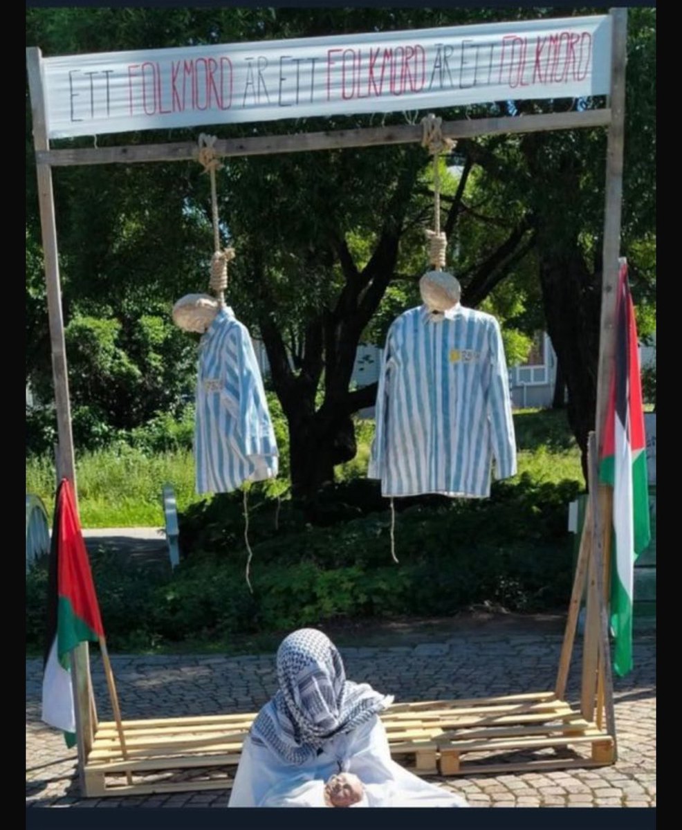 SachaRoytman's tweet image. In Sweden Today, a “pro-Palestinian protest” showed Jews hanging, dressed like Nazis did in the Holocaust, under a banner: “A genocide is a genocide.” This sick antisemitism.