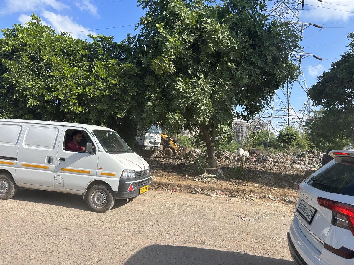 Jaishree Jindel (@jaishreejindel) on Twitter photo <a href="/MunCorpGurugram/">MCG</a> <a href="/OfficialGMDA/">GMDA</a> <a href="/CPCB_OFFICIAL/">Central Pollution Control Board</a> <a href="/cmohry/">CMO Haryana</a> - posh high rise in Gurgaon, with clear blue skies for a change, trees cows and no water logging !! But wait city authorities turning main land along SPR into a dumping ground ! Wow ! <a href="/MunCorpGurugram/">MCG</a> <a href="/OfficialGMDA/">GMDA</a> <a href="/CPCB_OFFICIAL/">Central Pollution Control Board</a> <a href="/cmohry/">CMO Haryana</a> - posh high rise in Gurgaon, with clear blue skies for a change, trees cows and no water logging !! But wait city authorities turning main land along SPR into a dumping ground ! Wow !