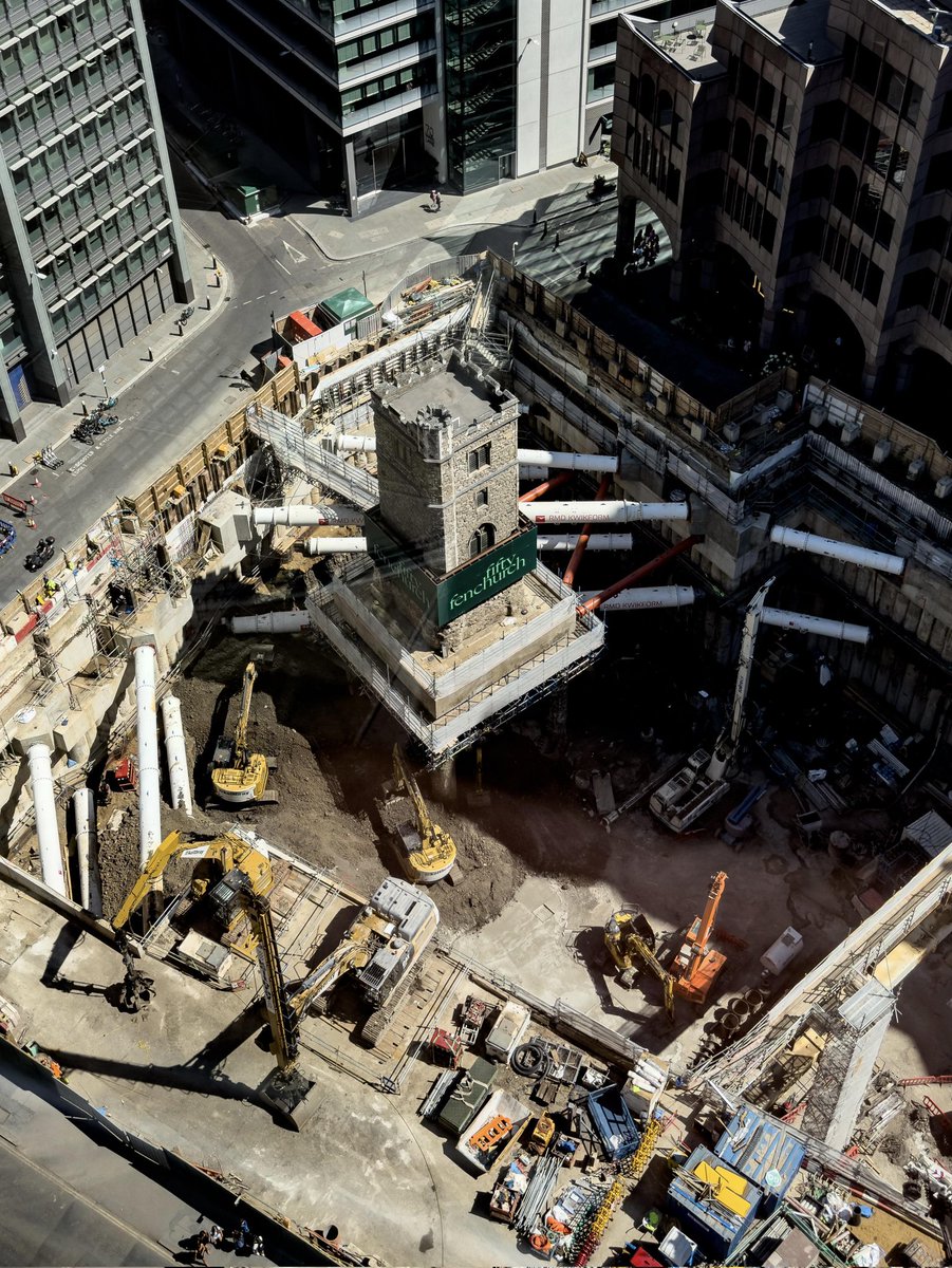 All Hallows Staining’s tower, built circa 1320 and one of #London’s oldest medieval relics, now stands elevated on columns as foundations are dug for a new skyscraper. A solitary stone sentinel amid encroaching steel and glass. 🏗️⛪ #Heritage