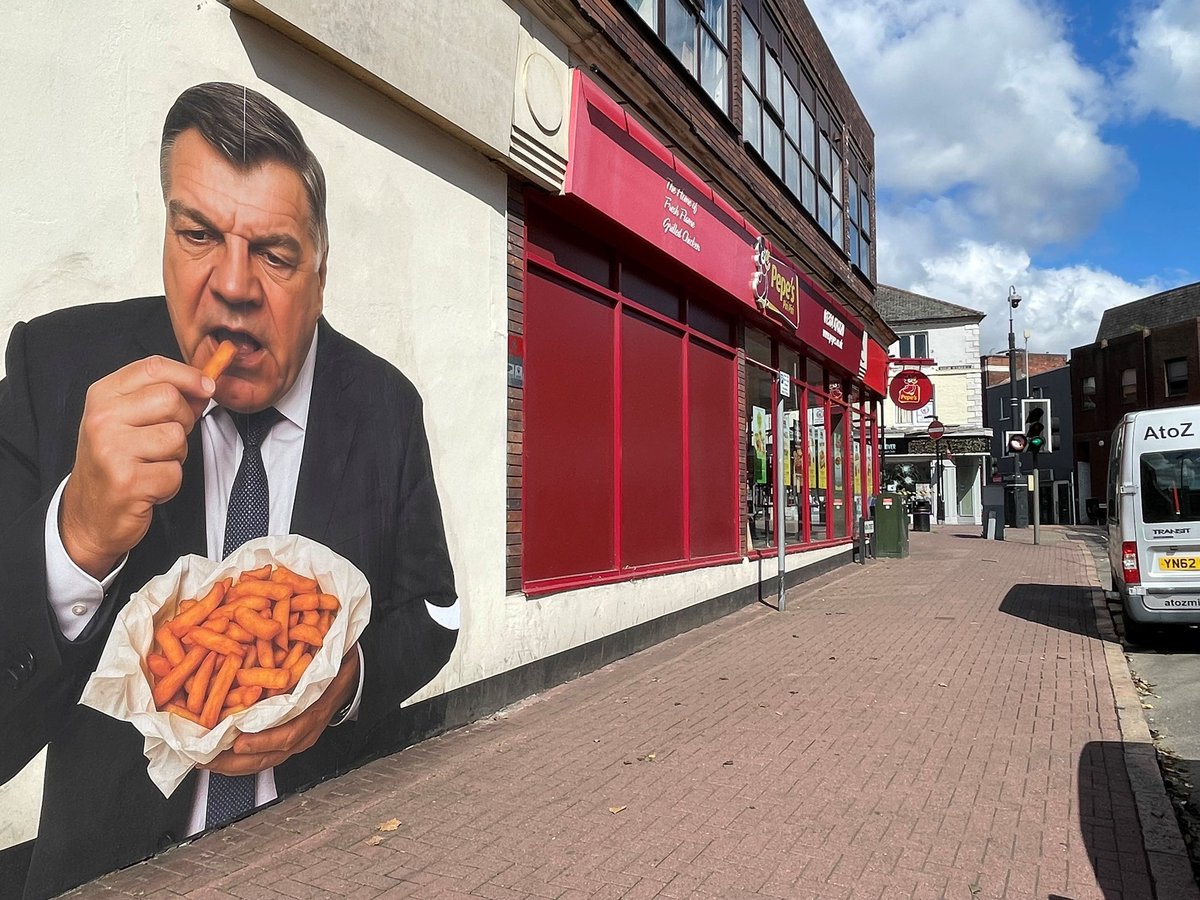A 10ft-high mural of Sam Allardyce, the former West Ham manager, enjoying a large bag of chips has appeared in his hometown of Dudley