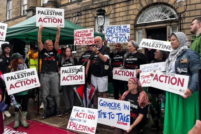 Activists have defied the Labour Government’s ban on Palestine Action by wearing illegal t-shirts outside Bute House in Edinburgh

Police were in attendance