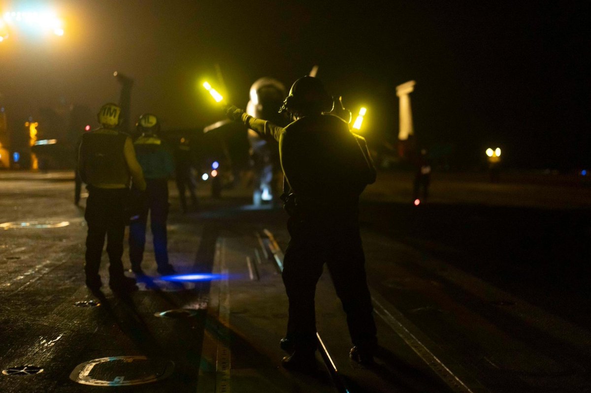 CENTCOM's tweet image. U.S. Sailors launch an F/A-18E Super Hornet from the deck of the USS Nimitz (CVN 68) during night time operations in the CENTCOM area of responsibility.