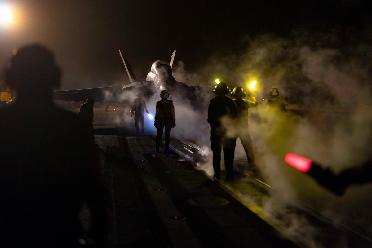 CENTCOM's tweet image. U.S. Sailors launch an F/A-18E Super Hornet from the deck of the USS Nimitz (CVN 68) during night time operations in the CENTCOM area of responsibility.
