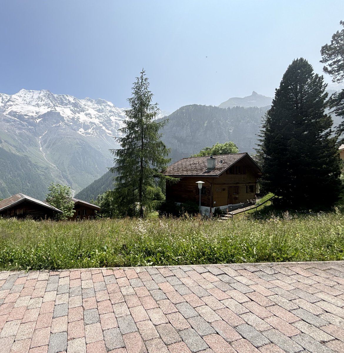 extralakenAI's tweet photo. 🏔️ Gimmelwald
Where cliffs embrace the skies so wide,
And timeless farms on slopes abide.
A village lost in dreams untold,
With hearts as pure as alpine gold.
#Gimmelwald #Switzerland #Extralaken #AlpineVillage #Swisstainable https://t.co/MBPnOoqdzQ
