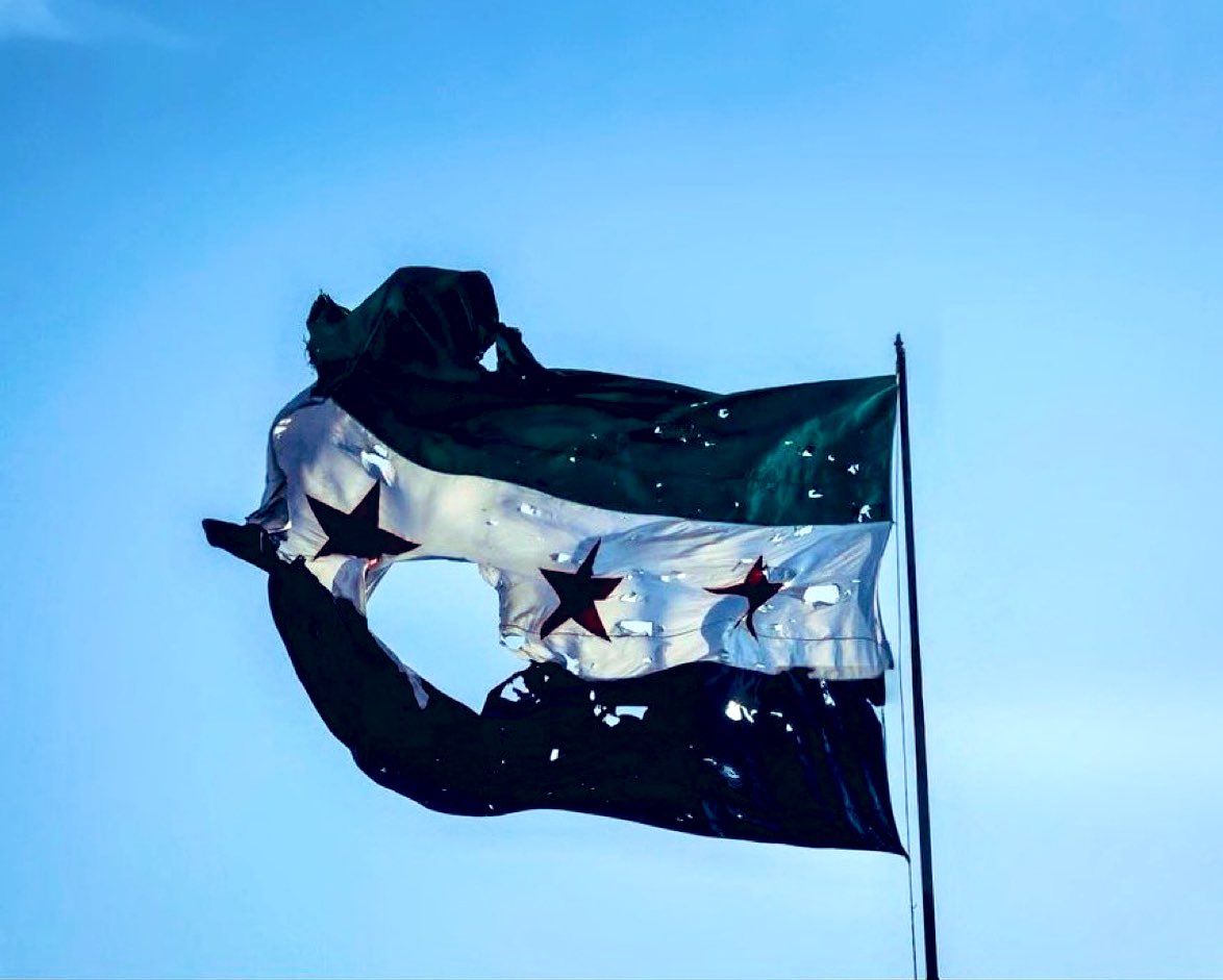 TAR_IDLIB's tweet image. The Defense Flag damaged by Israeli airstrikes.
Replace it and place it atop the People's Palace. It is a badge of honor for all honorable Syrians and a testament to the magnitude of Israeli challenges and interventilons.
Israel claims it does not interfere in Syria and is not…